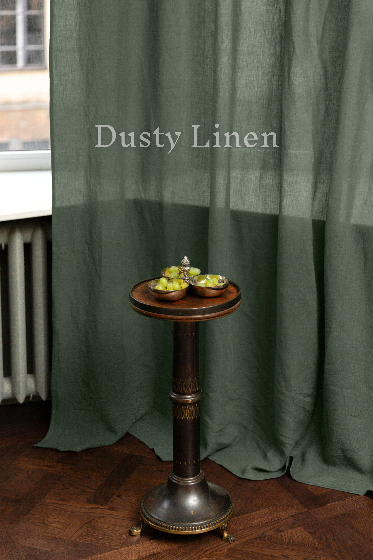 a wooden table topped with apples on top of a wooden floor