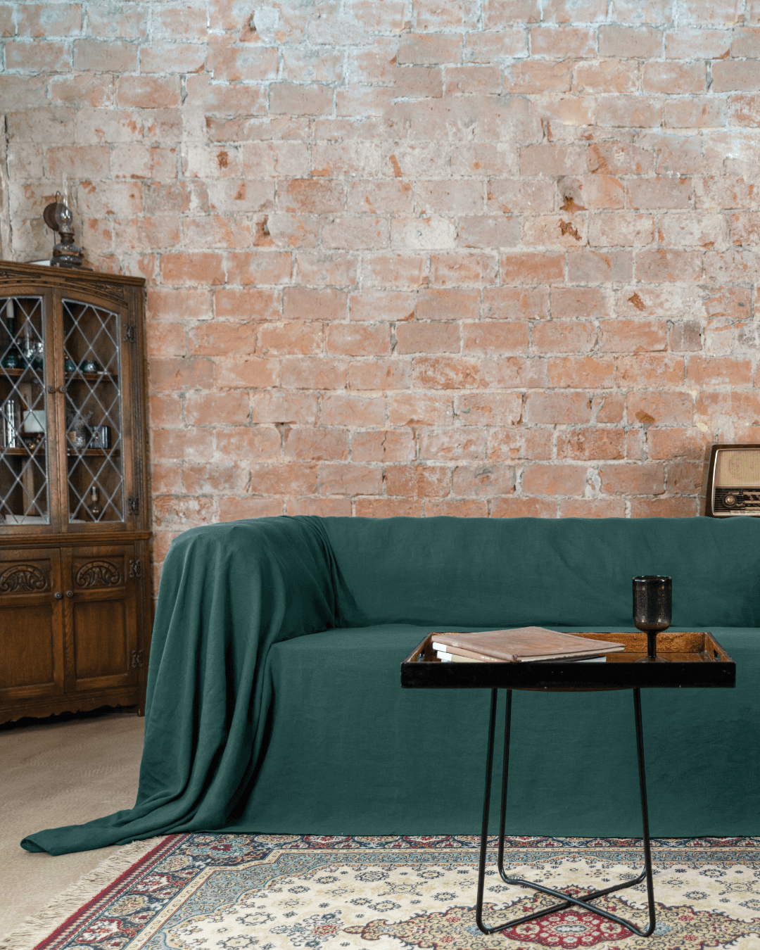 Emerald green linen couch cover on sofa, living room full view
