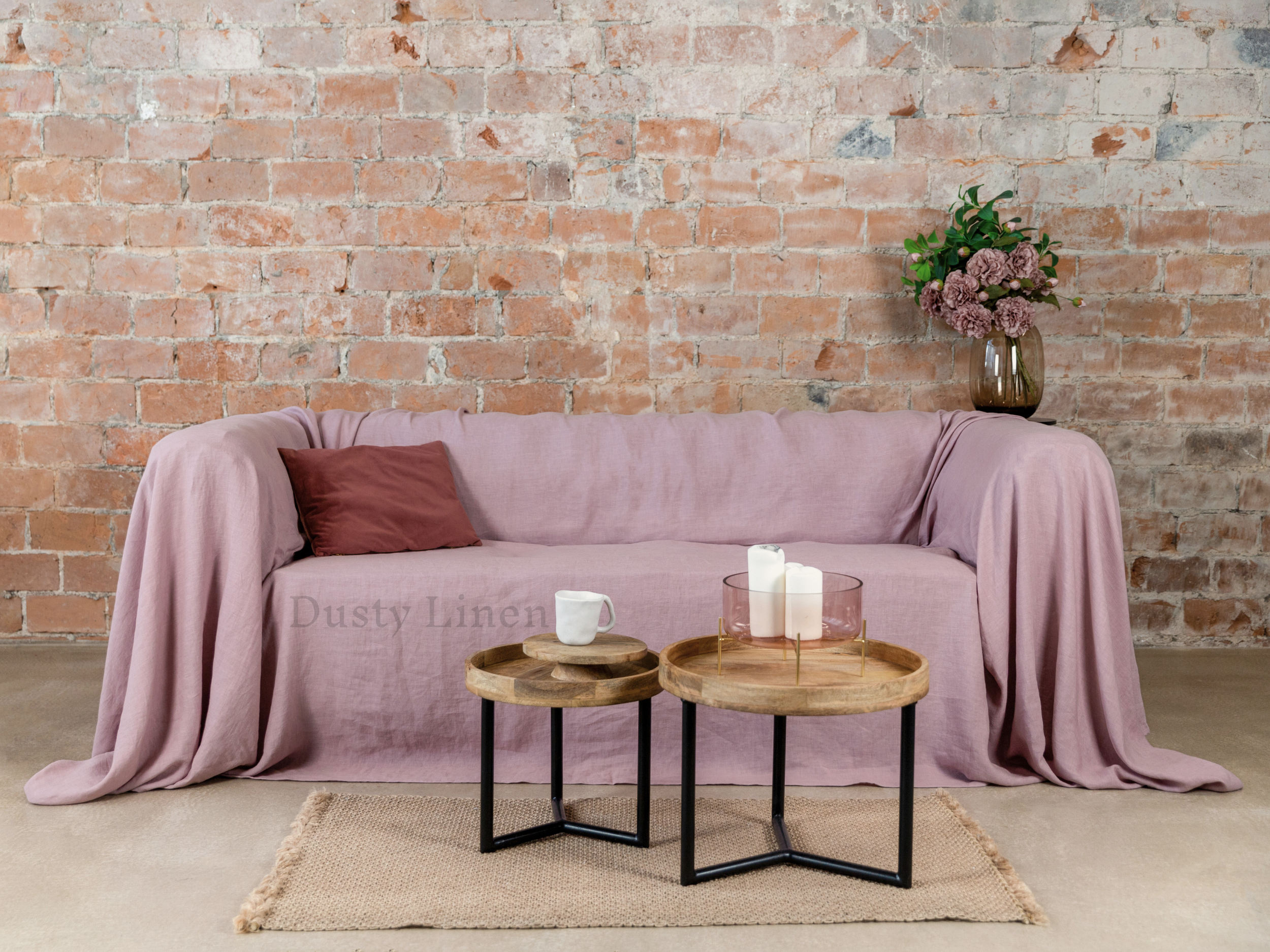 a living room with a couch and two tables