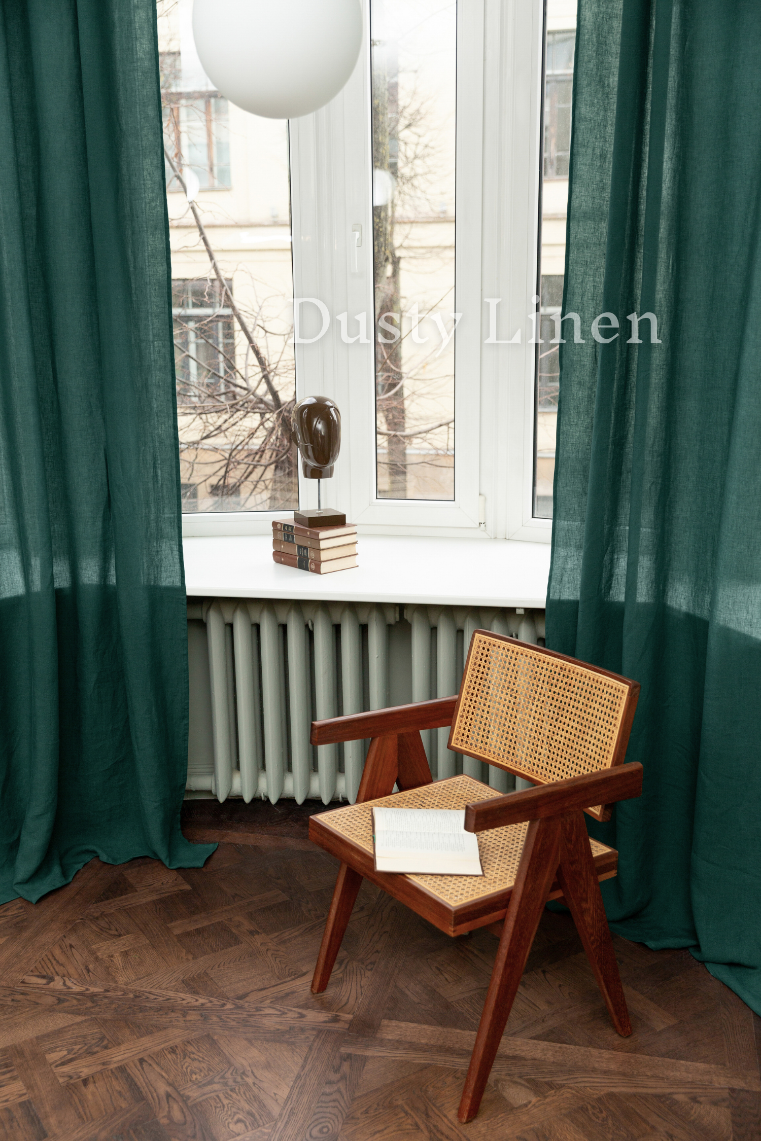 a wooden chair sitting in front of a window