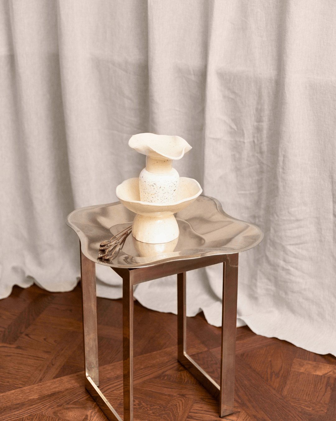 Natural light linen curtains in styled interior with table setting