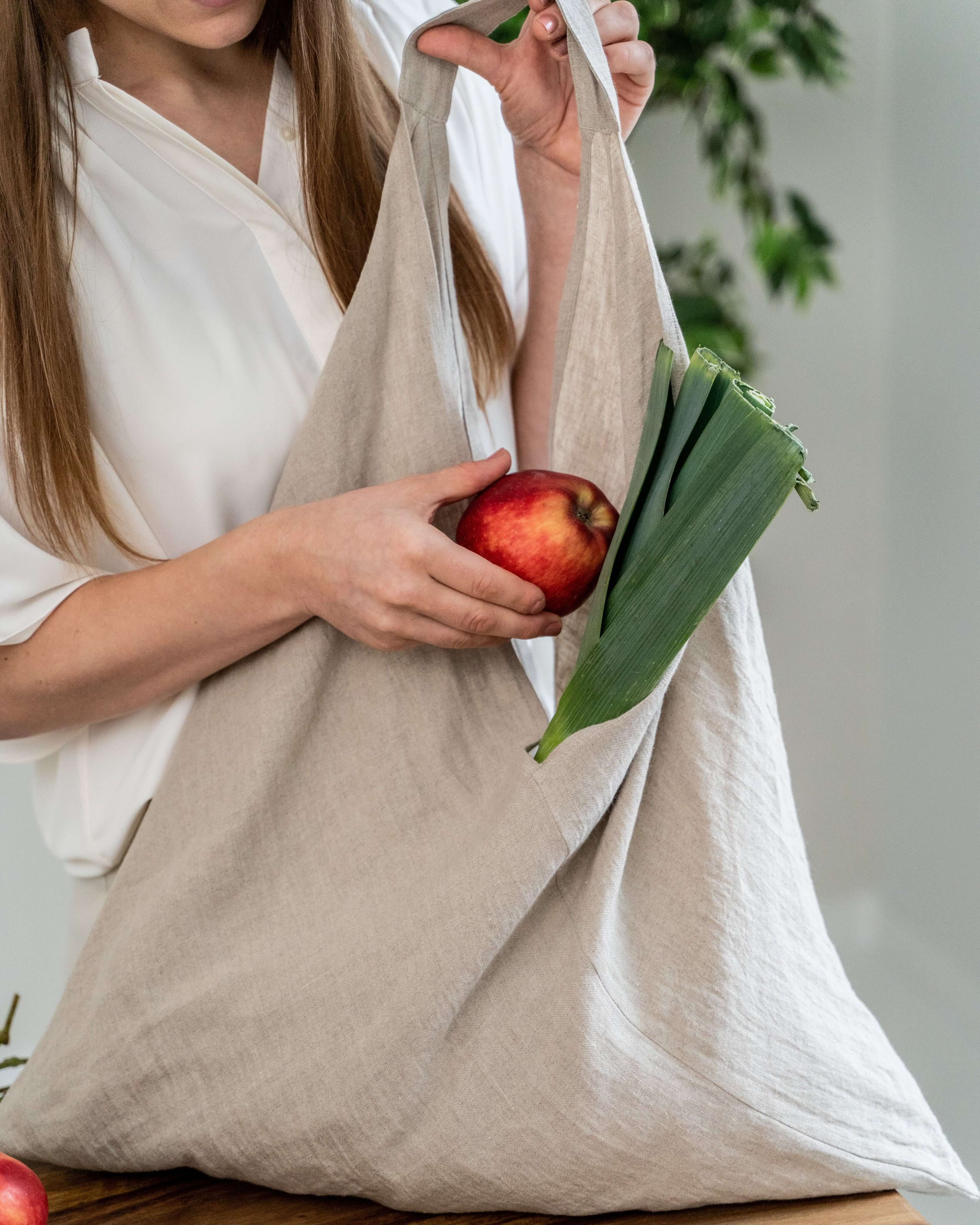 Large linen tote bag handle and stitching detail close-up