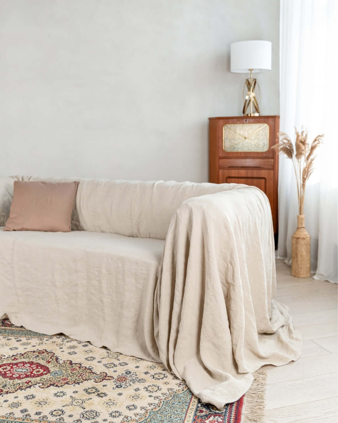 Natural linen couch cover loose drape, front view, 190 g/m²