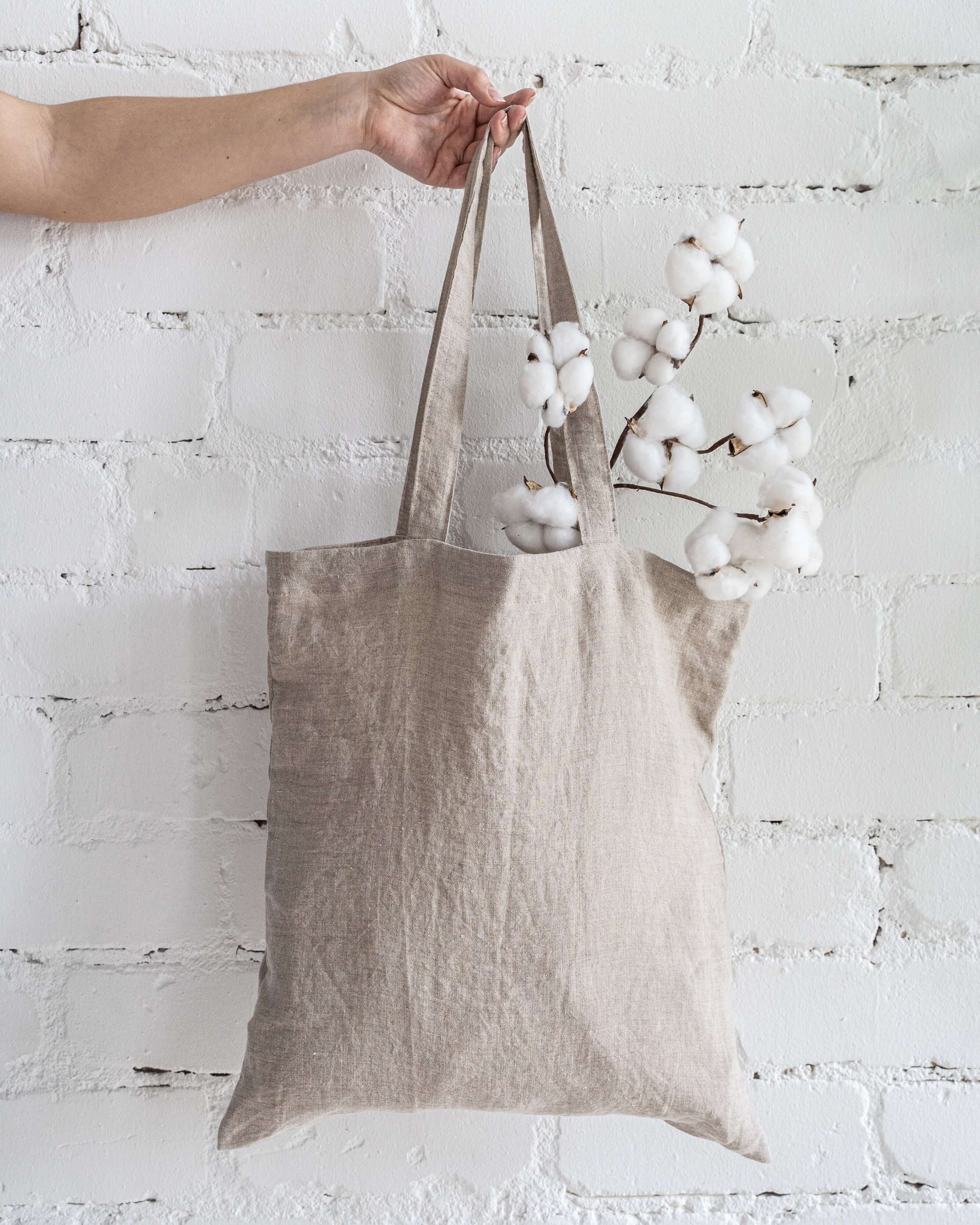 Linen tote bag handle and top edge detail close-up