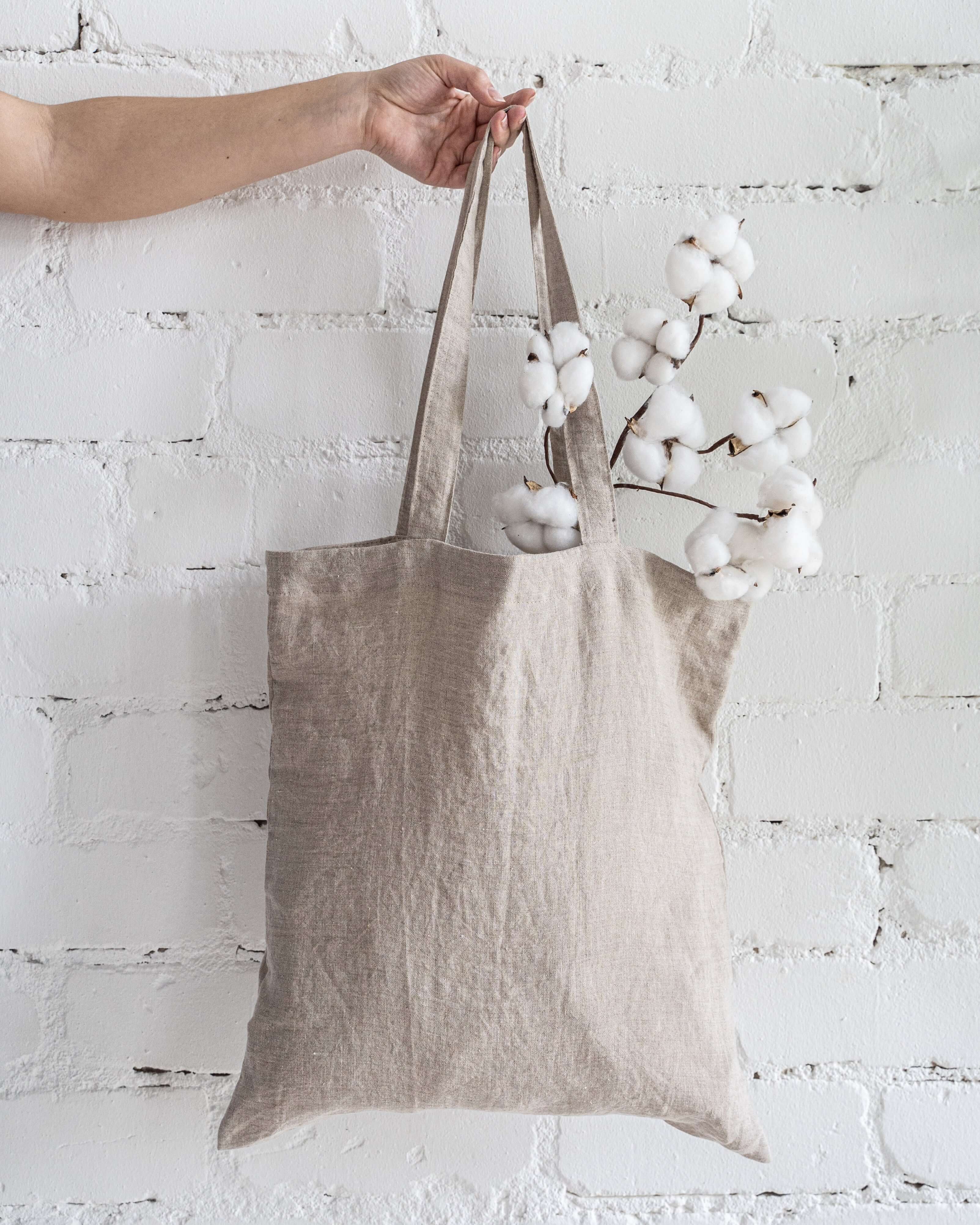 Linen tote bag handle and top edge detail close-up