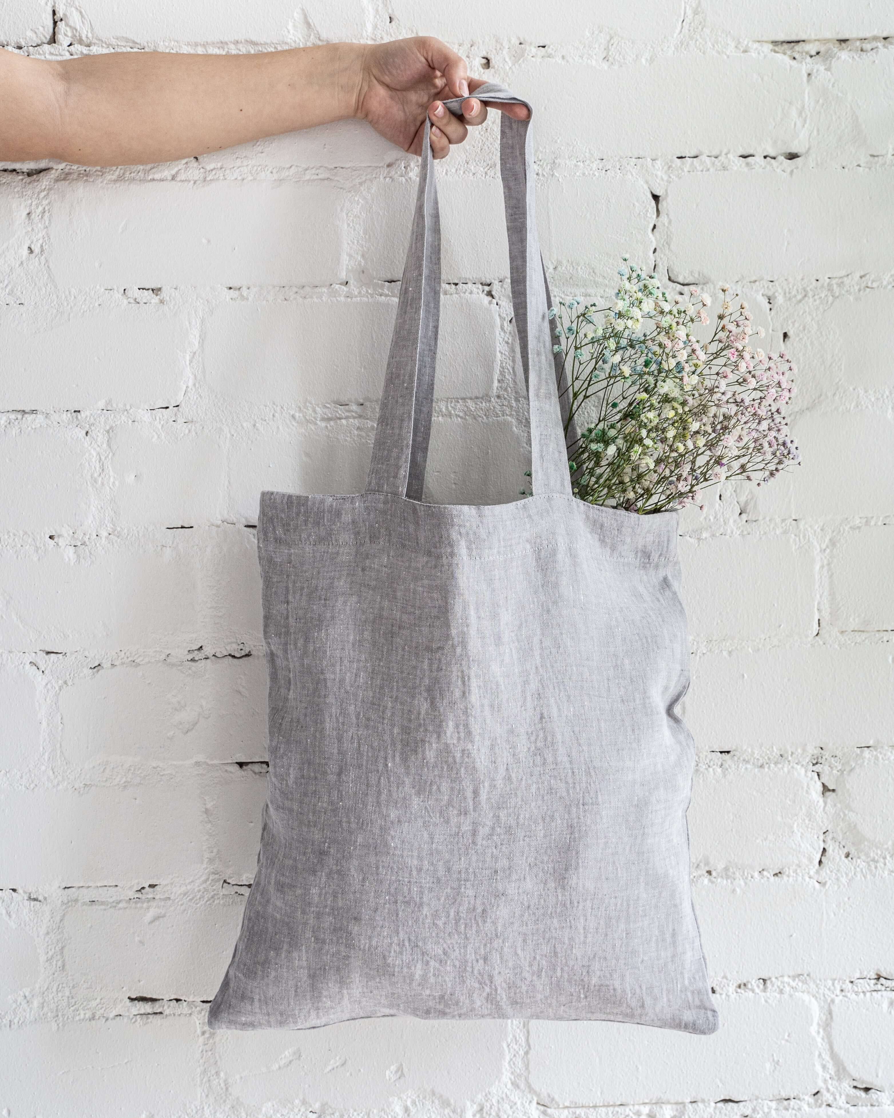 Linen tote bag hanging, showing natural drape and texture