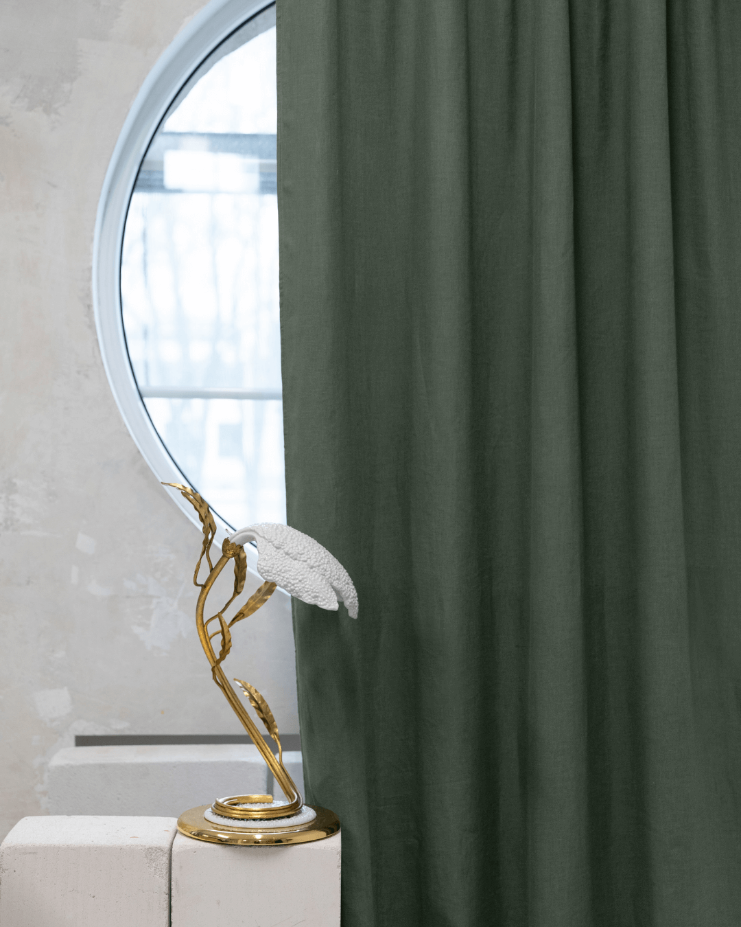 Safari green linen blackout curtains with decorative bird sculpture